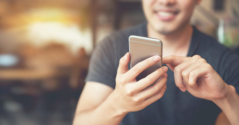 Man Looking at Digital Marketing on a Smartphone