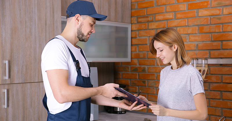 Plumber With Happy Customer