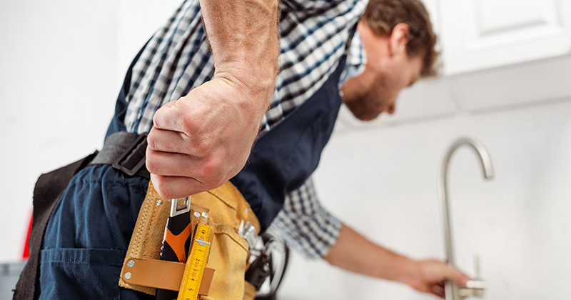 Plumber Working on Sink