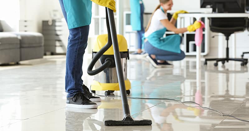 Cleaner vacuuming floor