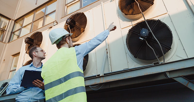 HVAC manager and technician on the job