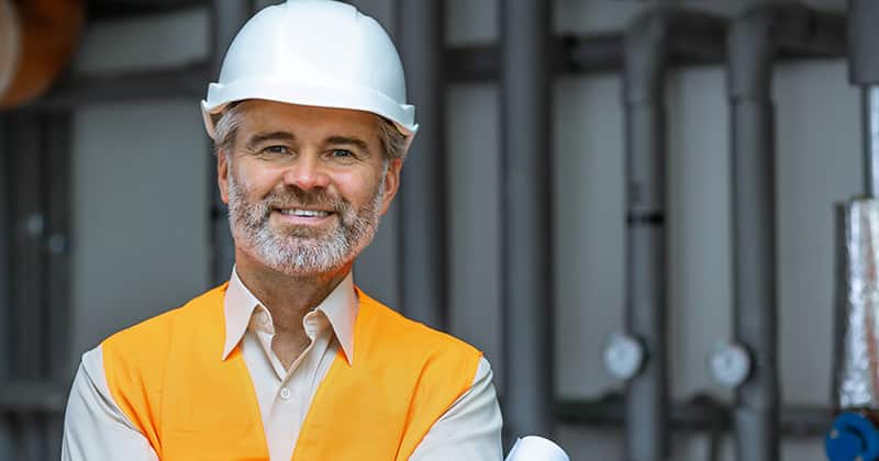 HVAC manager smiling at the camera