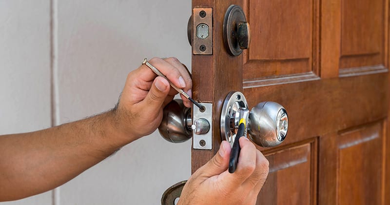 Up close of someone working on door