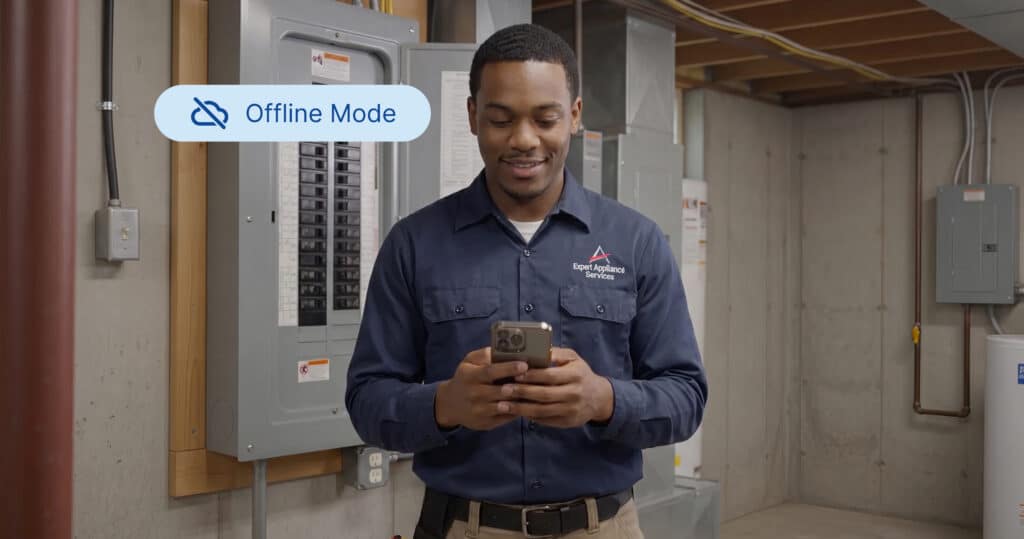 A service technician works on his phone without service while using Service Fusion's Offline Mode.
